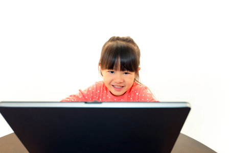 beautiful little girl using a laptop