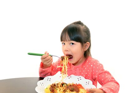 child having spaghettiの写真素材