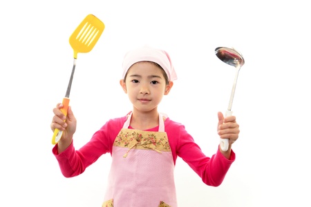 The girl who enjoys cookingの写真素材