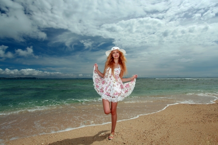 young woman on the beach enjoy sunlightの写真素材