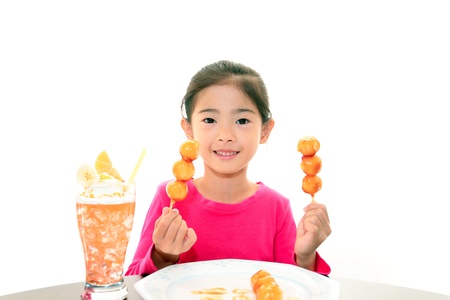 Girl of the smile having a snackの写真素材