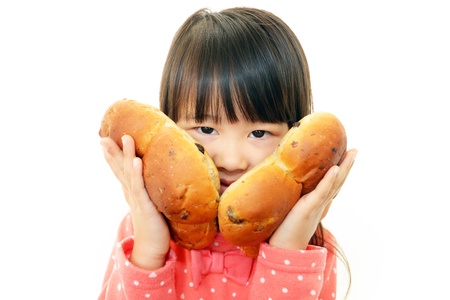 Girl having breadの写真素材
