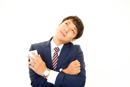 Expression of melancholy businessman の写真素材