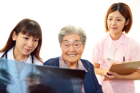 Old wonan and the medical staff of smileの写真素材