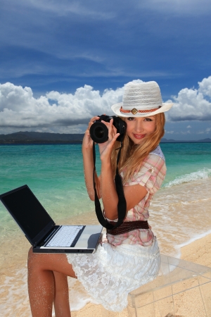 young woman making photo using slrの写真素材