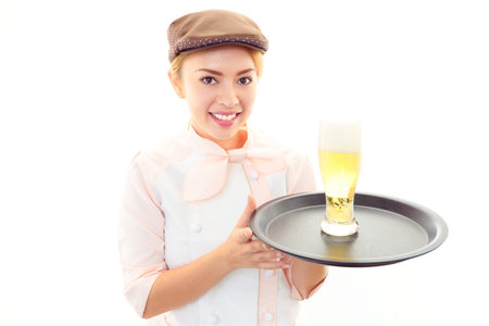 Smiling waitress carrying a beer