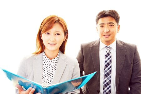 A businessman and the office lady who confirm documents の写真素材