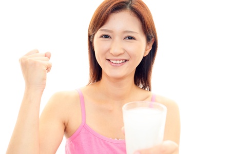 Relaxed woman with a milkの写真素材
