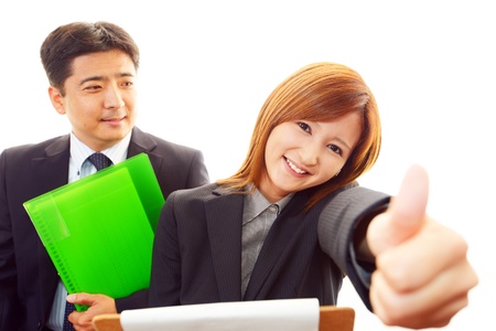 A businessman and the office lady who confirm documents の写真素材