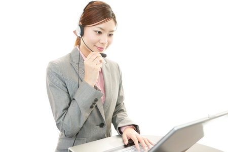 Woman with a handsetの写真素材