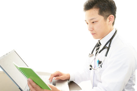 Smiling  Asian medical doctor