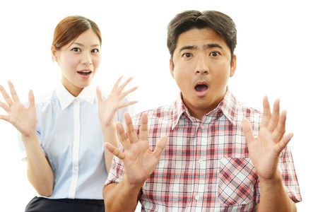 surprised husband and wifeの写真素材
