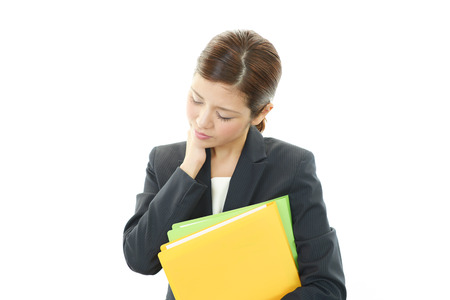 Business woman with shoulder pain の写真素材
