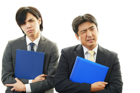 Stressed Asian businessmenの写真素材