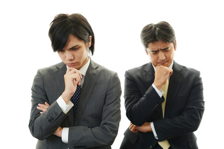 Stressed Asian businessmen の写真素材