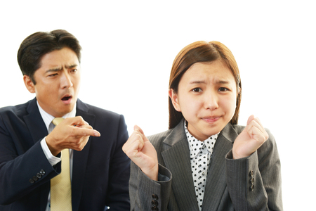 Dissatisfied businessman and businesswomen の写真素材