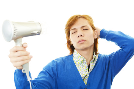 A man taking care of his hairの写真素材