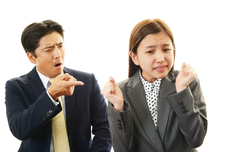 Dissatisfied businessman and businesswomen の写真素材