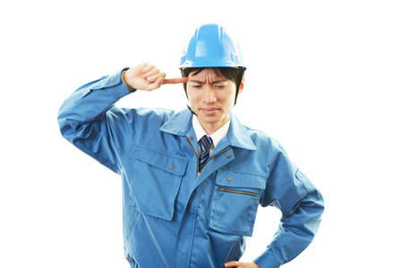 Worker having a headacheの写真素材