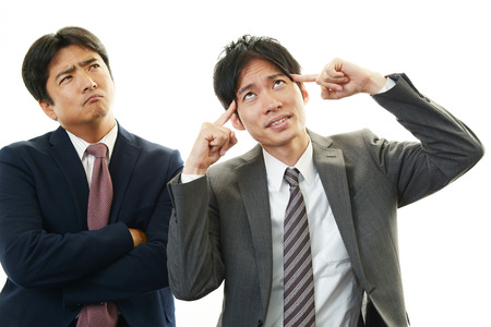 Stressed Asian businessmen の写真素材