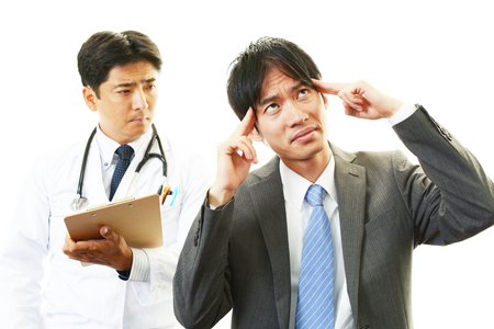 Doctor examining a patientの写真素材