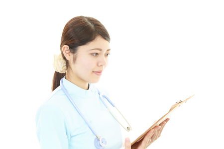 Depressed Asian female nurseの写真素材