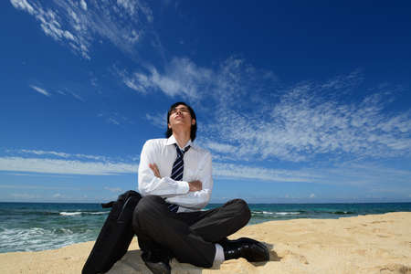 The man who relaxes on the beach 	の写真素材