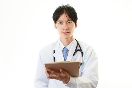 Smiling Asian doctor の写真素材