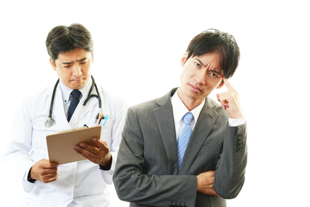 Doctor examining a patientの写真素材