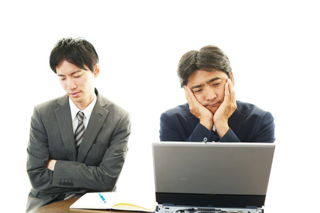 Stressed Asian businessmen の写真素材