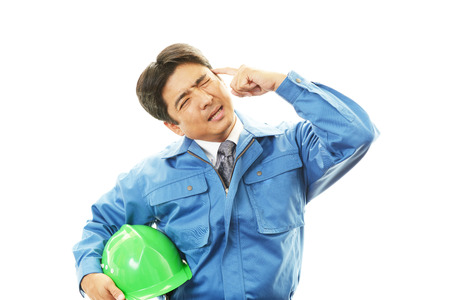 Worker having a headacheの写真素材