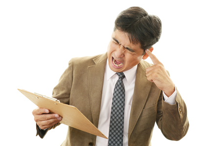Businessman having a headache の写真素材