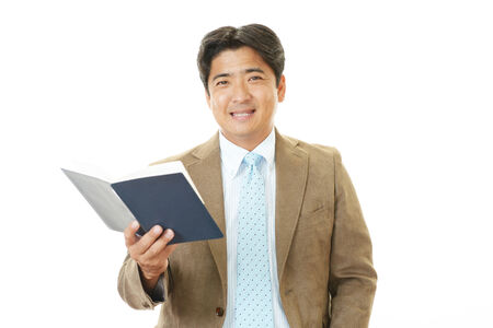 Smiling Asian businessmanの写真素材