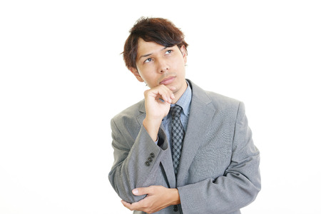 Tired and stressed Asian businessmanの写真素材