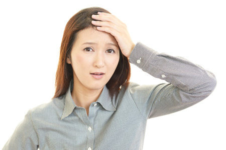 Tired and stressed young business womanの写真素材