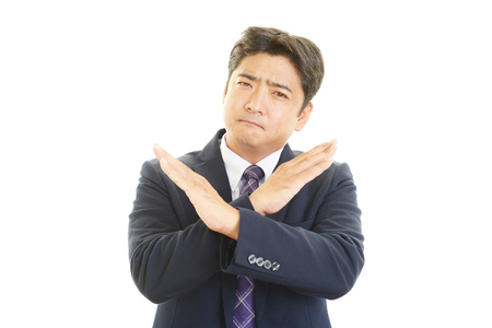Businessman showing no good signの写真素材