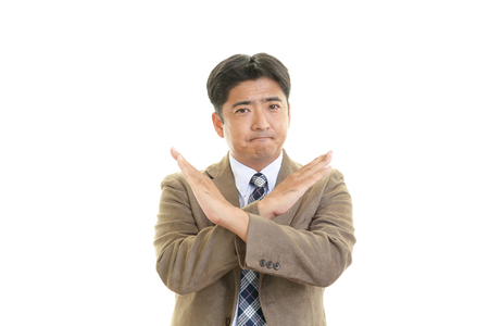 Businessman doing no good signの写真素材