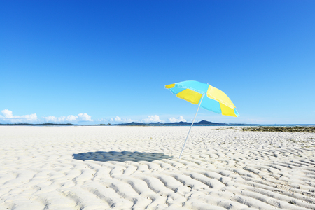 The beach and the beach umbrella of midsummer.の写真素材