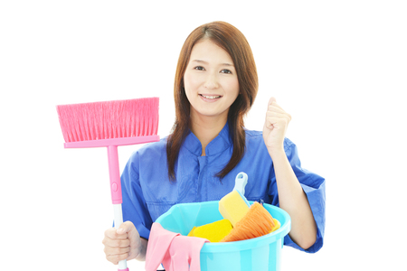 Young smiling cleaner woman.の写真素材