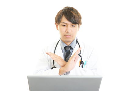 Disappointed Asian medical doctorの写真素材