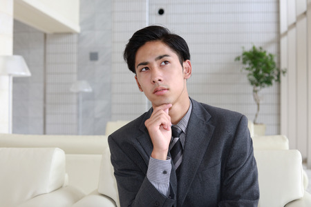 Dissatisfied Asian businessmanの写真素材
