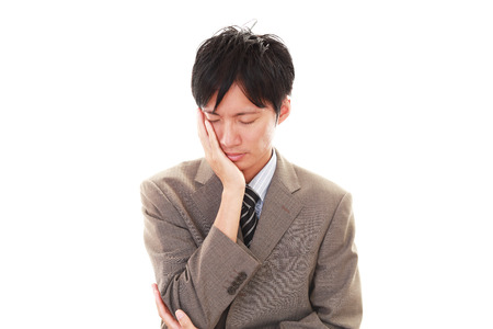 Disappointed Asian businessmanの写真素材