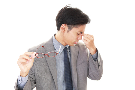 Tired Asian businessmanの写真素材