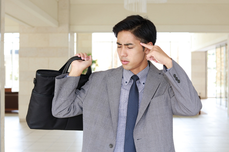 Disappointed Asian businessmanの写真素材