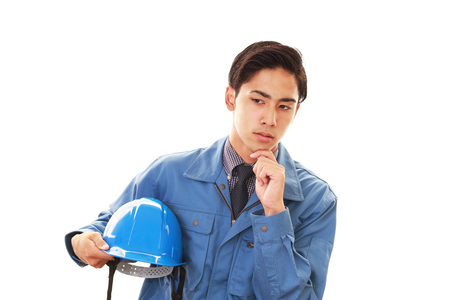 Tired and stressed Asian workerの写真素材