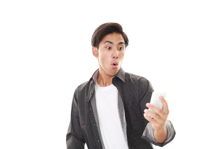 Surprised Asian manの写真素材