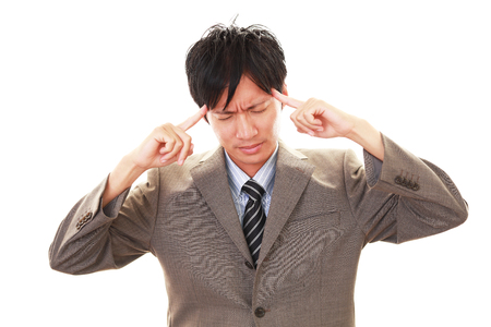 Businessman having a headacheの写真素材