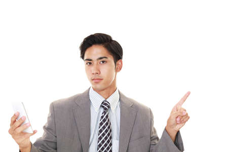 Businessman holding a smart phoneの写真素材