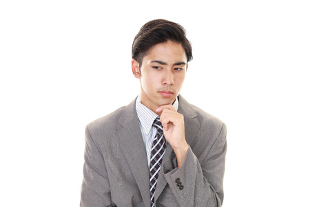 Depressed Asian businessmanの写真素材