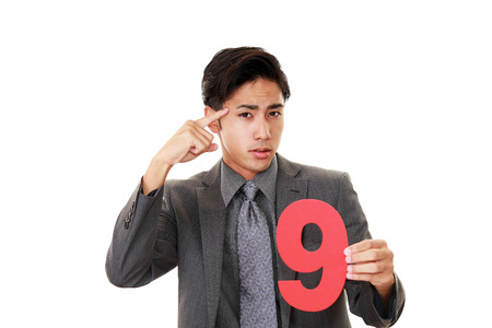 Portrait of businessman looking uneasy.の写真素材